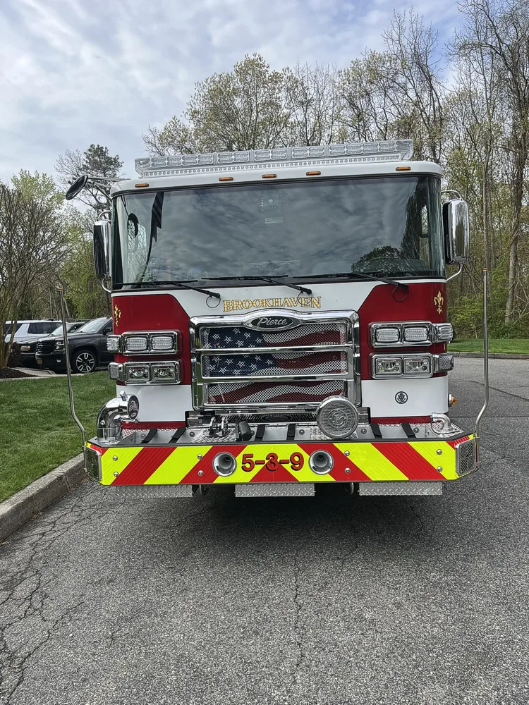 Pierce Saber pumper front view showing grille, bumper, and warning lights