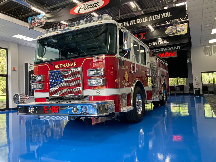 Front-left exterior view showing cab and side body in station