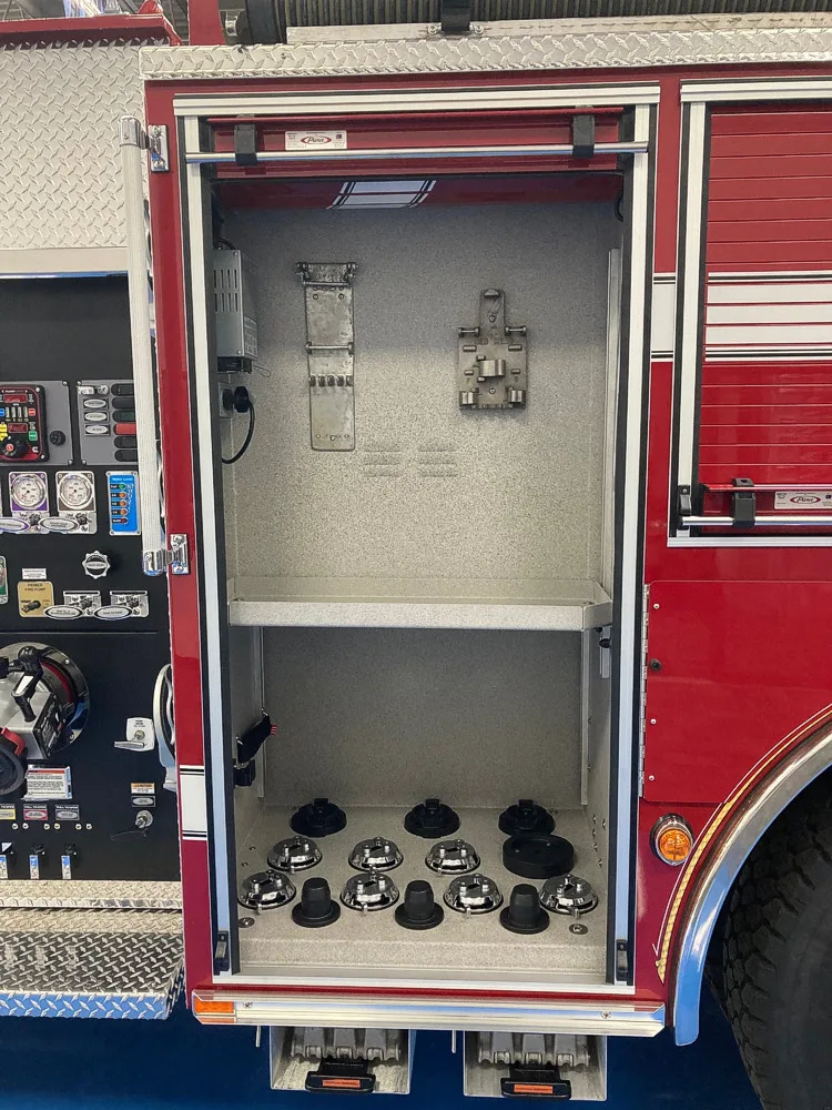 Open side compartment showing pump-side controls and fittings