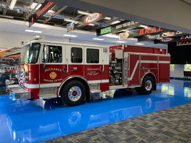 Front-left exterior view showing cab corner and side profile