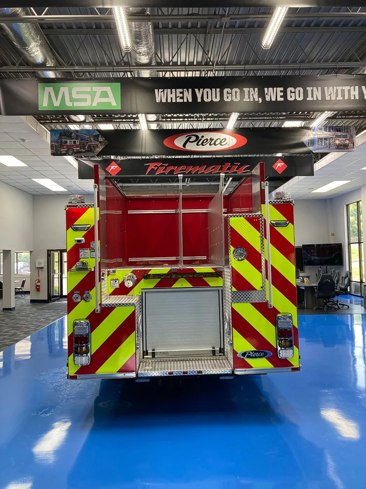 Rear view showing red-and-yellow chevrons and centered rear opening