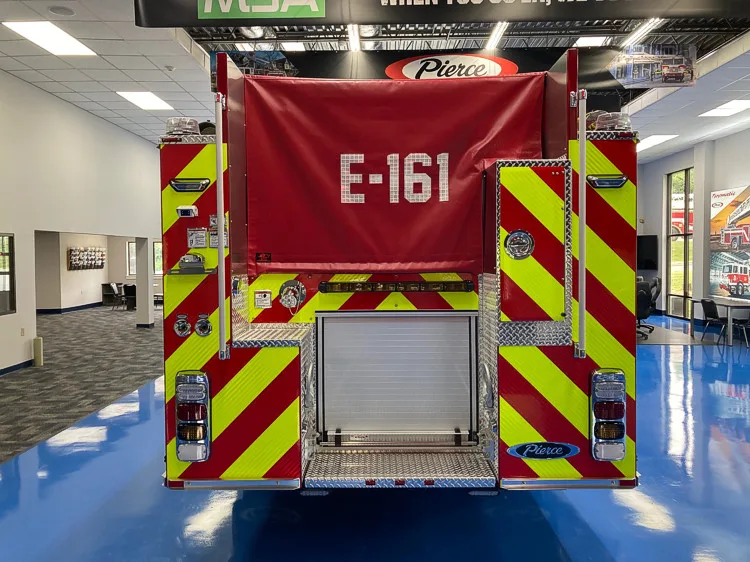 Rear view with rear door closed showing chevrons and unit number