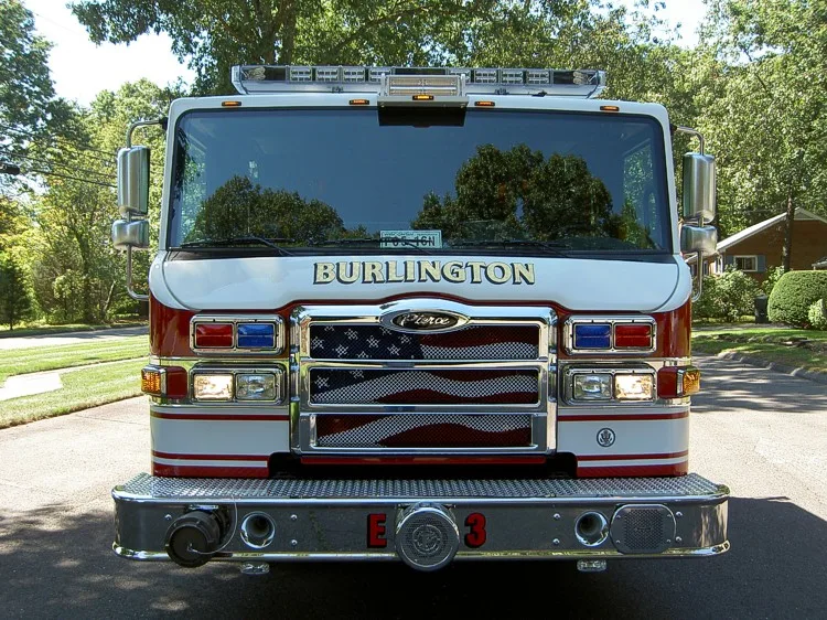 Front exterior view showing grille, bumper, and warning lights