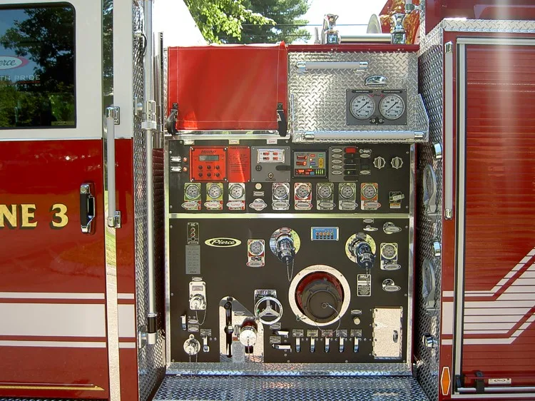 Pump panel close-up showing gauges, valves, and intake connections
