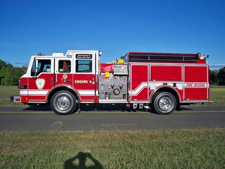 Driver-side full profile view showing side compartments and wheelbase