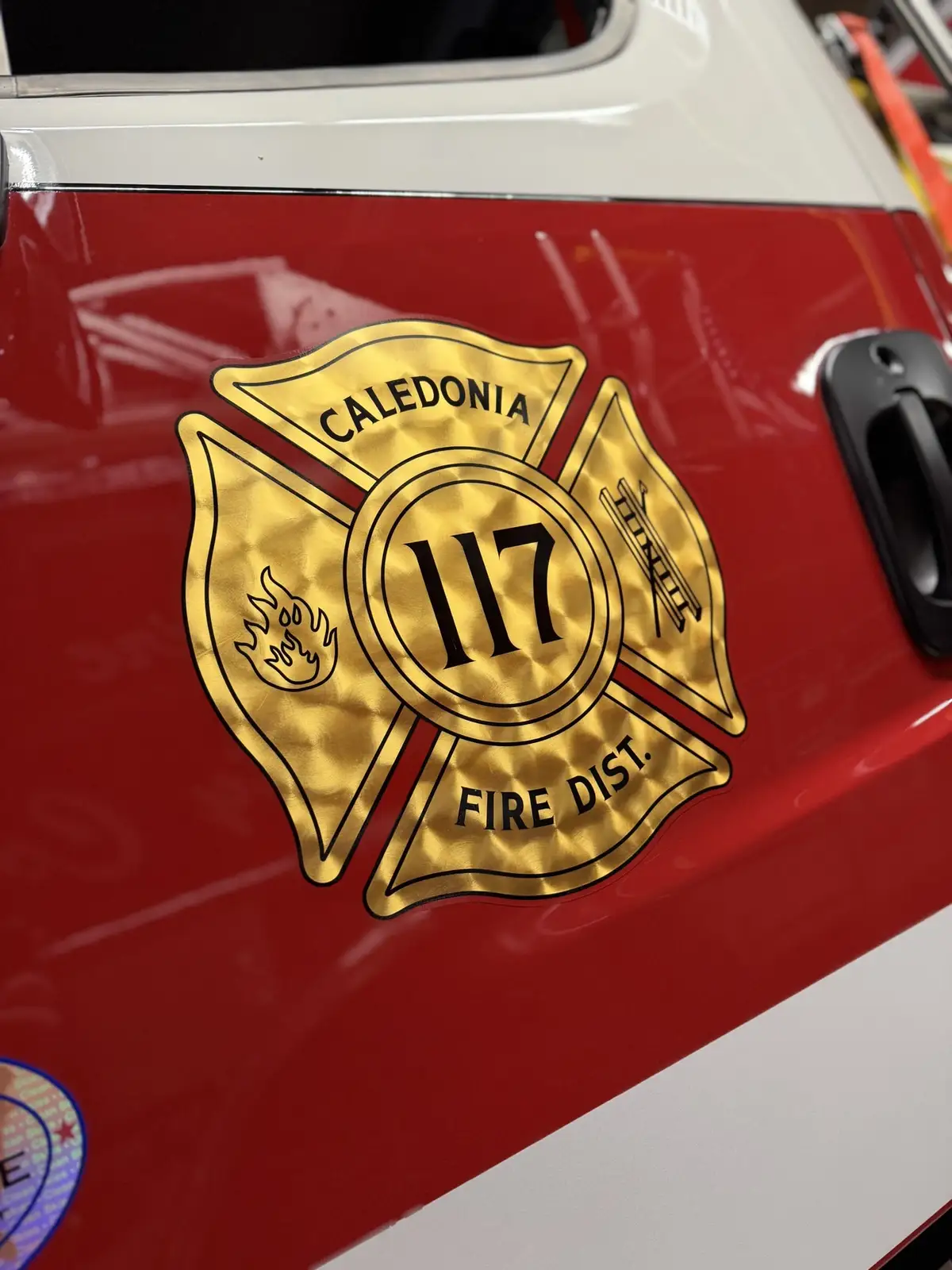 Cab door close-up showing department crest and unit number