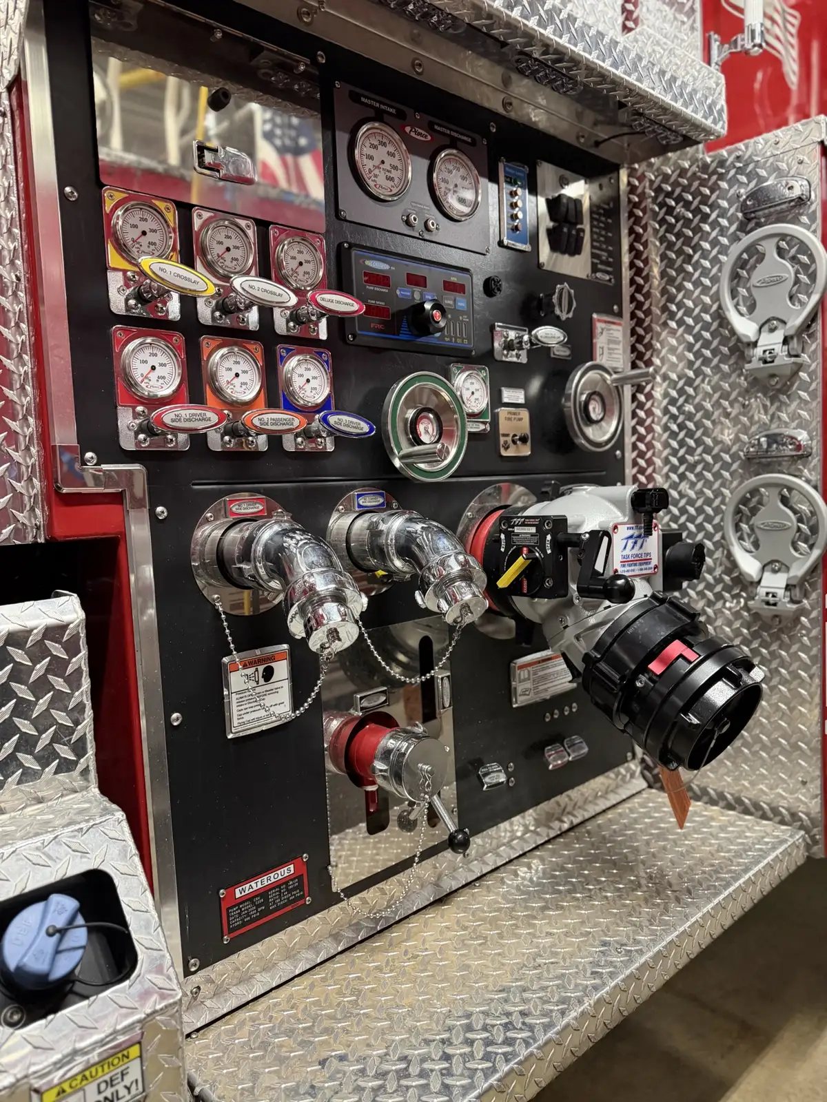 Pump panel close-up showing gauges, valves, and large intake connection