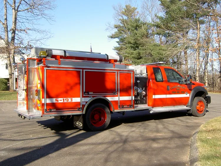 Rear-right exterior view showing side body compartments and rear chevron panel