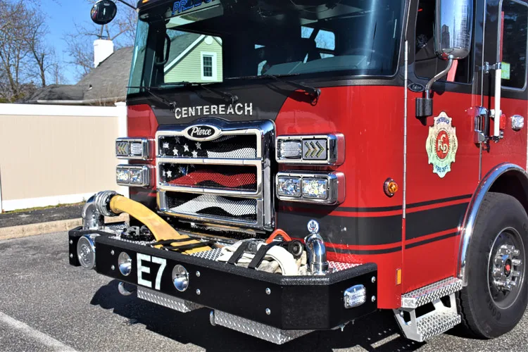 Front bumper close-up showing intake fitting, grille detail, and warning lights