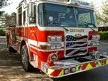 Pumper front-left exterior view showing bumper, cab, and side compartments