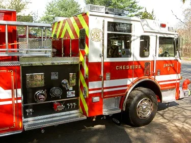 Driver-side pump panel view showing gauges, valves, and intake connections