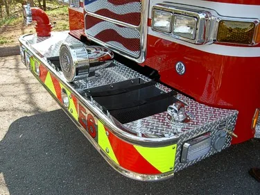 Front bumper close-up showing intake ports and treadplate step surfaces