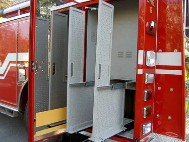 Open side compartment view showing tall storage bays and adjustable shelves