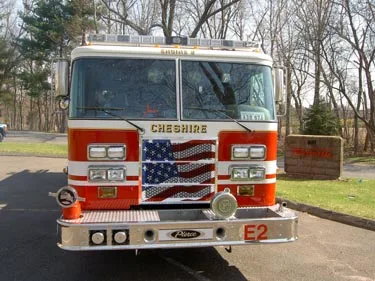 Front exterior view showing grille, bumper, and warning lights