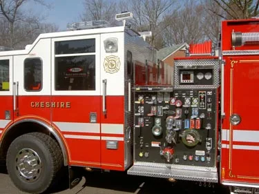 Pump panel close-up showing gauges, valves, and side controls