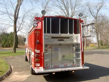 Rear view showing rear panel, warning lights, and hosebed area