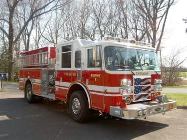Front-right exterior view showing bumper, cab, and side body