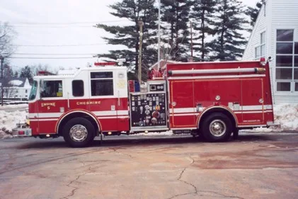 Driver-side profile showing exposed pump panel and side body compartments