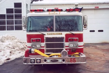 Front exterior view showing grille, bumper, and warning lights