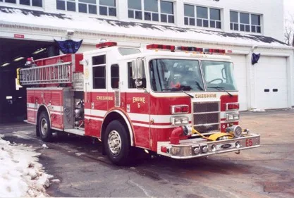 Front-right exterior view showing bumper, cab, and side body