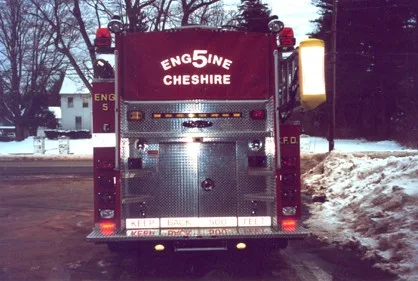Rear view showing rear panel, warning lights, and lower hosebed area