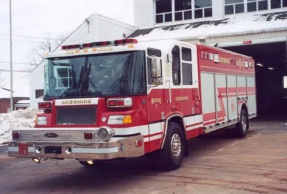 Front-left exterior view showing bumper, grille, and long rescue body