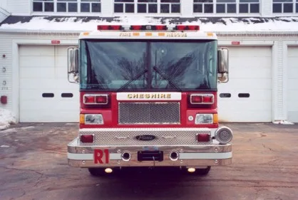 Front exterior view showing grille, bumper, and warning lights