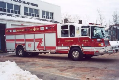 Front-right exterior view showing long body and side panel striping