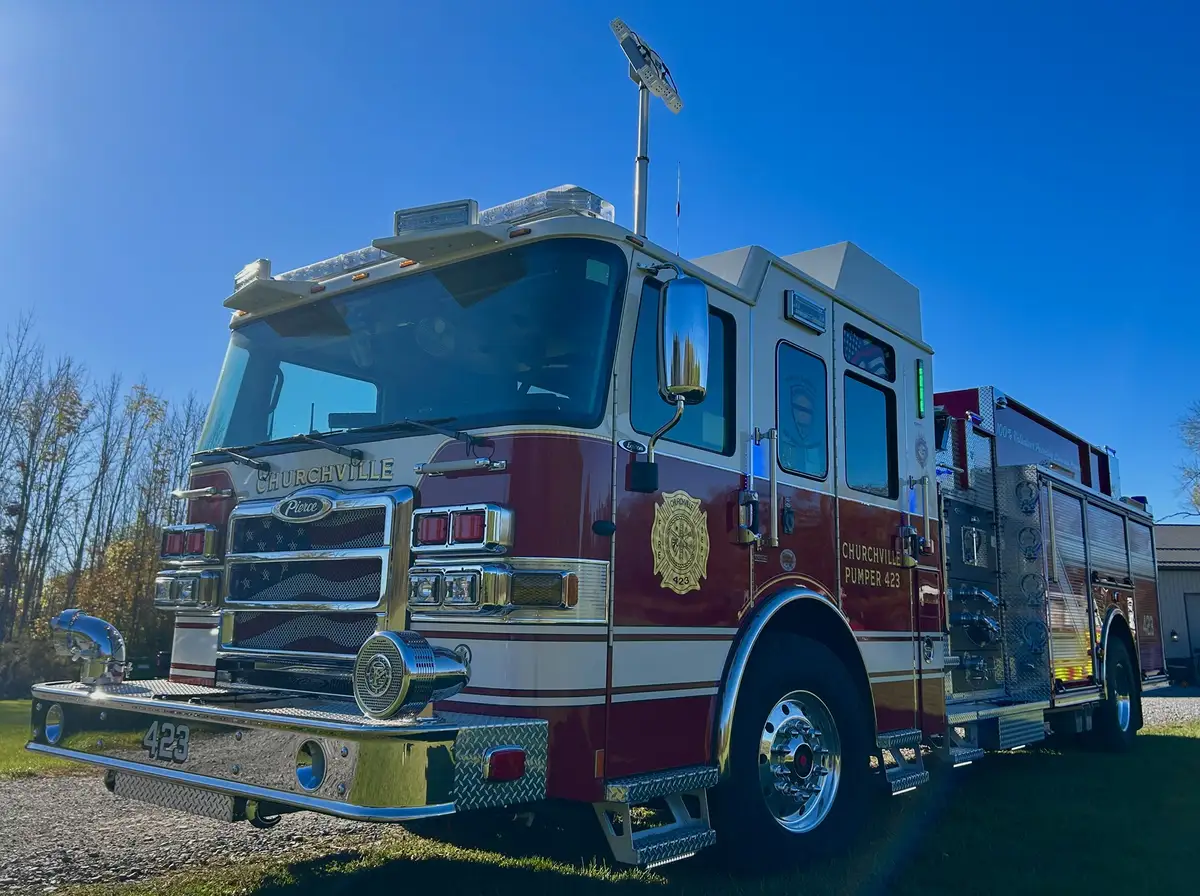 Pierce pumper front-right exterior view showing grille, bumper, and warning lights