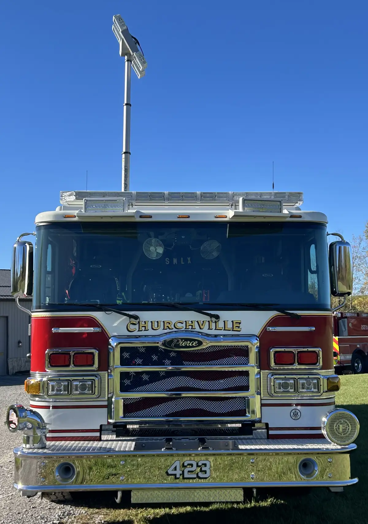 Pierce pumper head-on front view with grille, bumper, and light bar