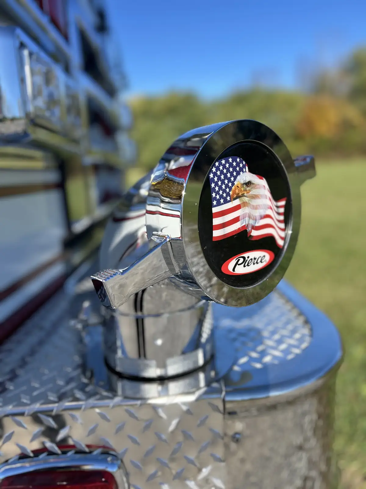 Front bumper intake cap close-up with emblem detail