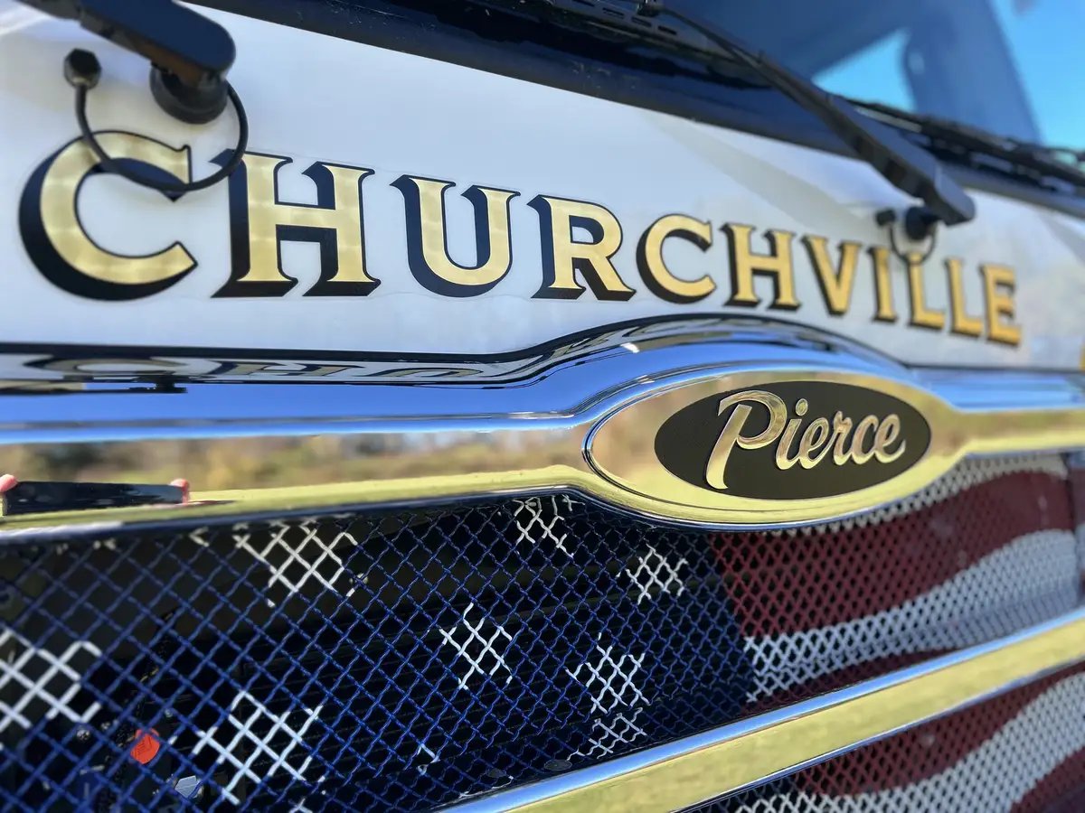 Front grille close-up with city name script and Pierce badge