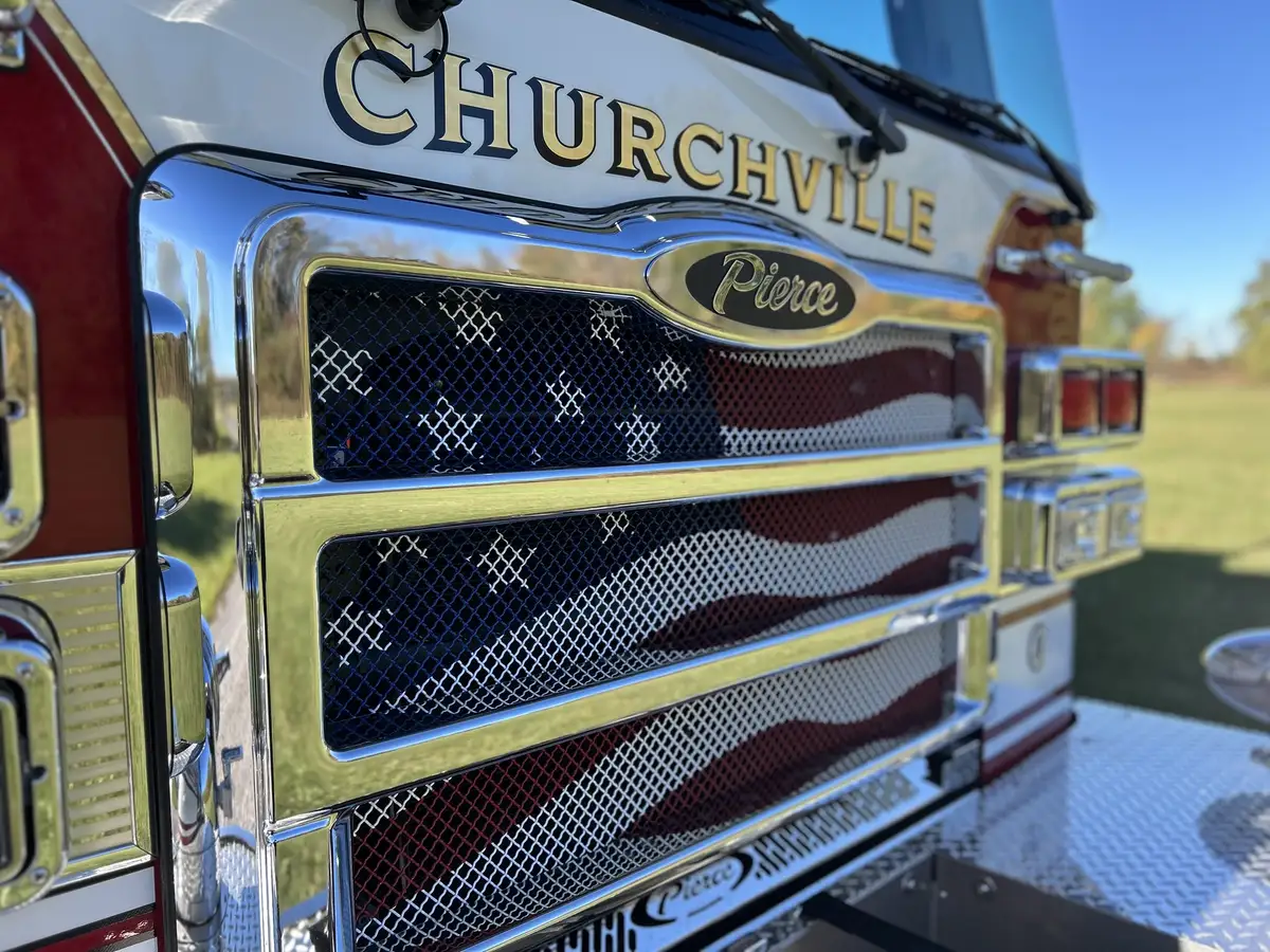 Front grille and chrome trim close-up with Pierce emblem