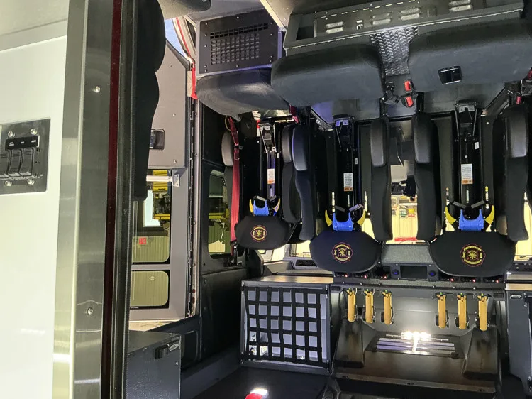 Crew interior wide view showing SCBA seats and rear storage netting