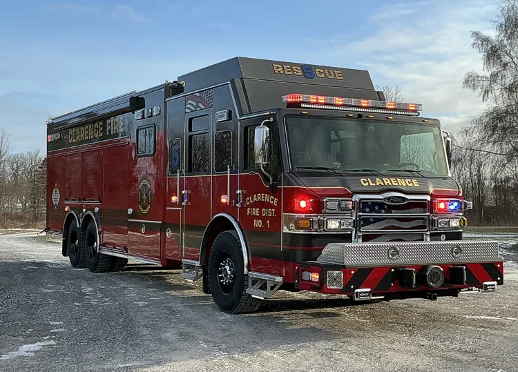 Aerial ladder truck front-right exterior view showing cab and side body