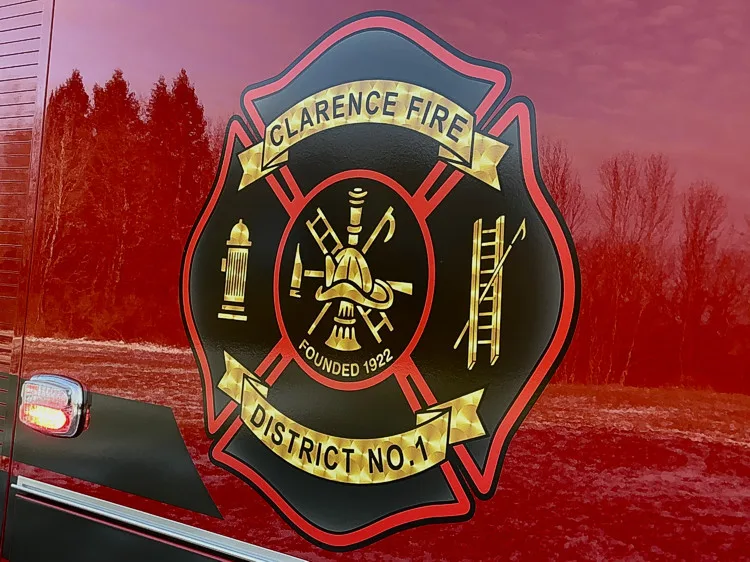 Side crest logo close-up on red compartment door