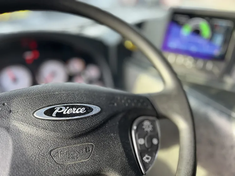 Steering wheel and instrument cluster close-up from driver seat