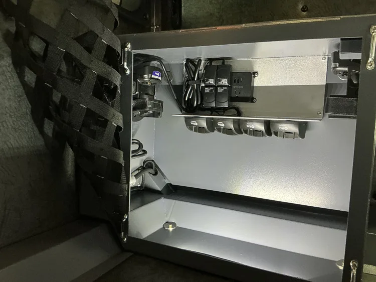 Small interior charging cubby with mounted radio chargers