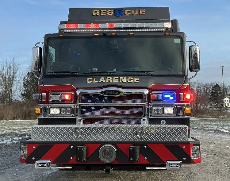 Head-on front view showing grille, bumper intakes, and warning lights