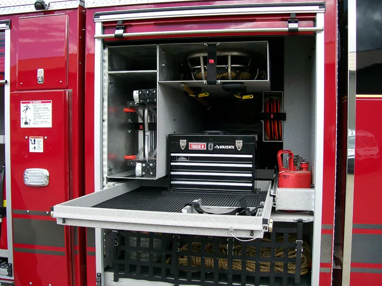 Open side compartment showing pull-out tray with mounted tool chest