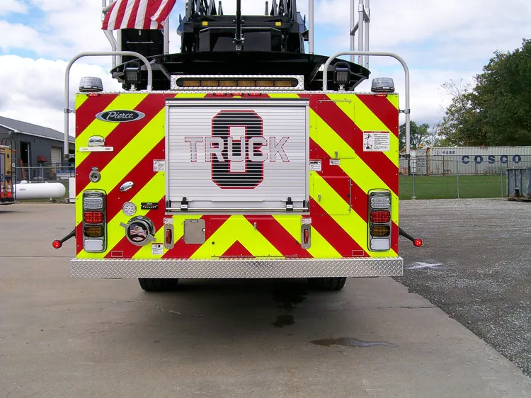 Rear view showing red-and-yellow chevrons and centered rear panel