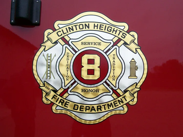 Cab door close-up showing fire department crest badge