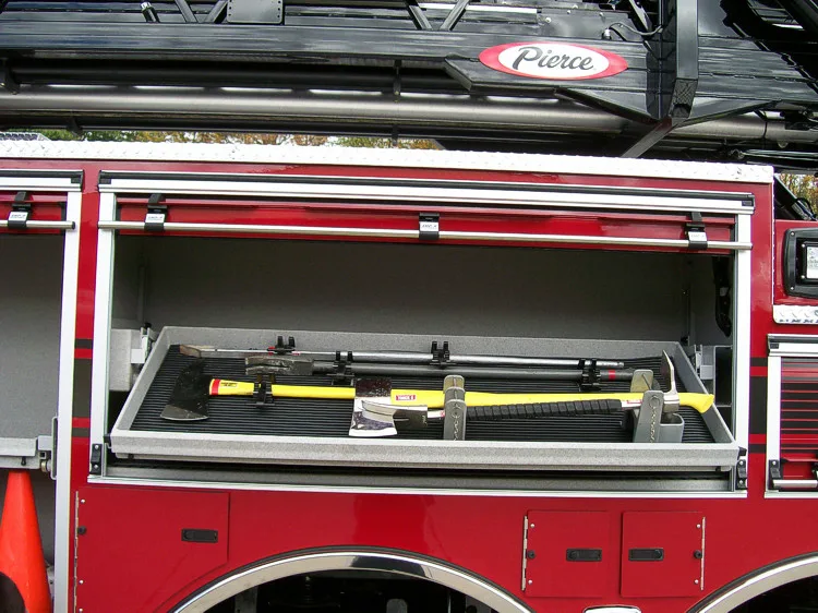 Open side compartment showing mounted hand tools in horizontal rack
