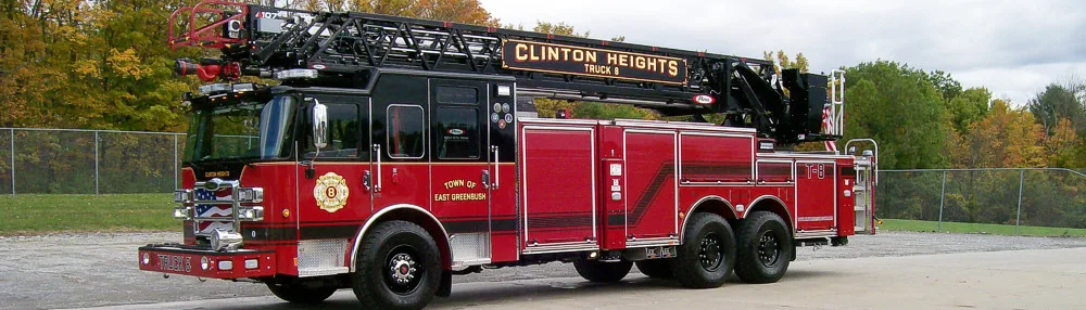 Tower ladder truck driver-side profile showing full apparatus length