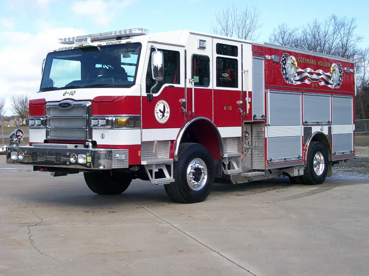 Front-right wide view highlighting the cab, bumper, side compartments, and rear wheel area.