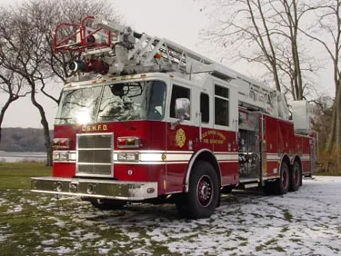 Front-right exterior view showing cab and aerial ladder sections