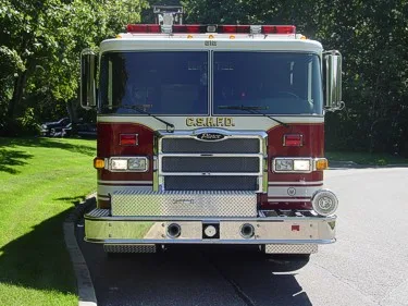 Front exterior view showing grille, bumper, and warning lights