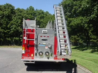 Rear view showing rear panel, ladders, and lower hose connections