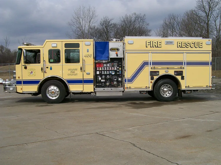 Driver-side profile with open pump panel showing gauges and controls