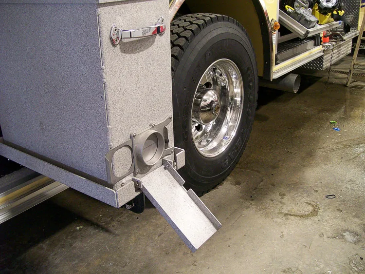 Lower body close-up showing fold-down step near rear wheel